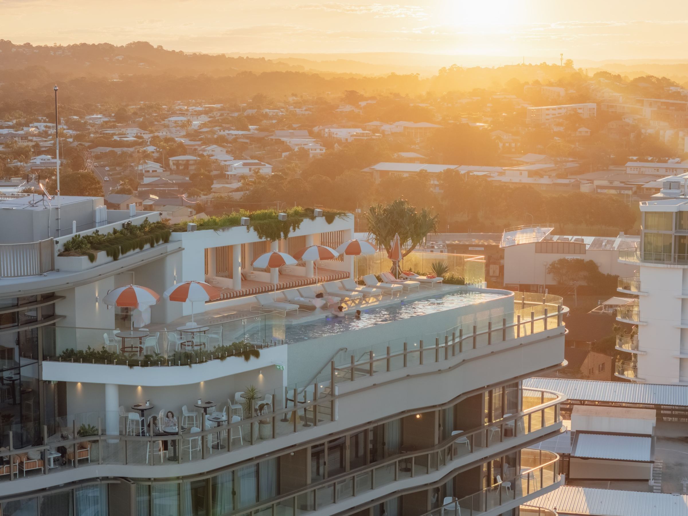 Rooftop pool and terrace at sunset